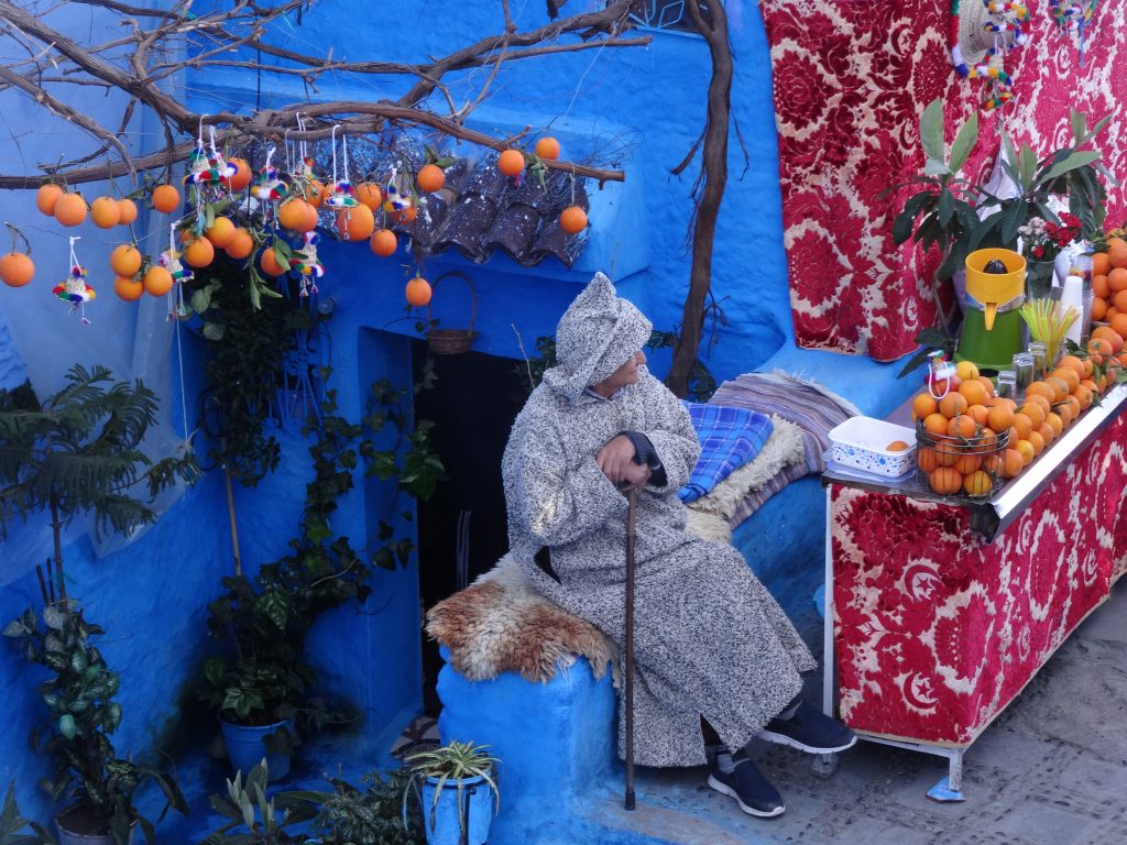 Man selling orange juice Chefchaouen